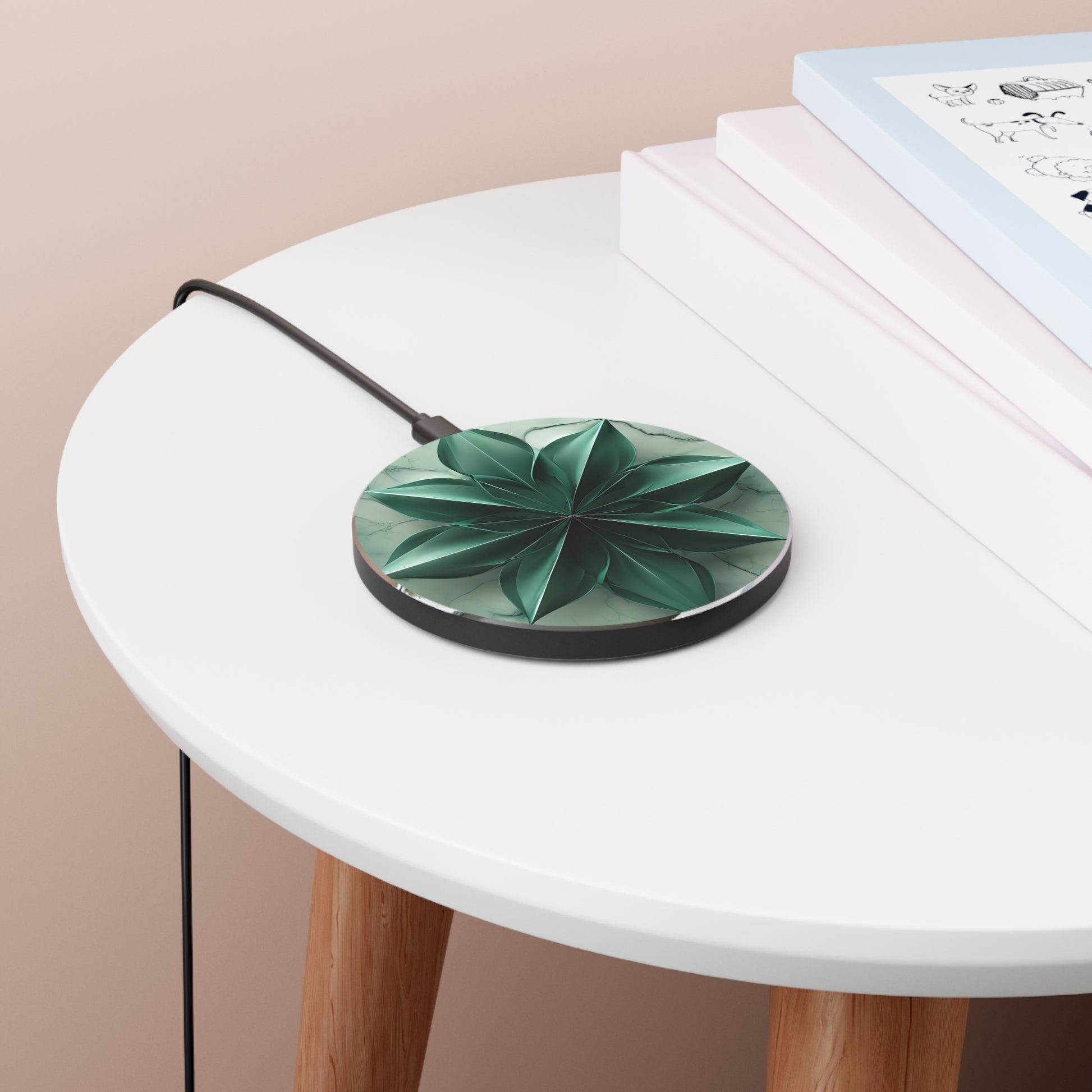 Emerald Bloom emerald green floral mandala art Qi wireless charger on bedside table with books