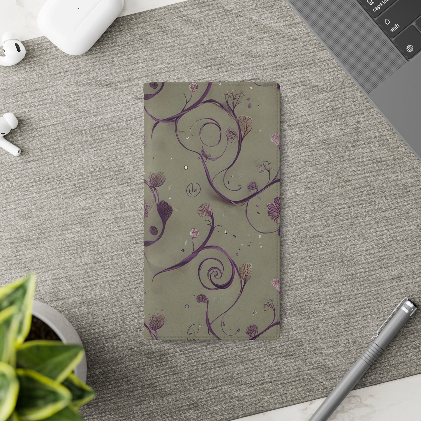 Twilight Thistle Bloom Samsung Galaxy wallet flip phone case on a desk beside stationery featuring purple thistle floral design and folio card holder