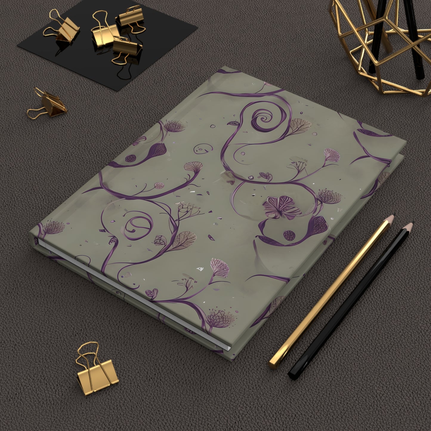 Twilight Thistle Bloom hardcover journal on desk with pencils and stationery