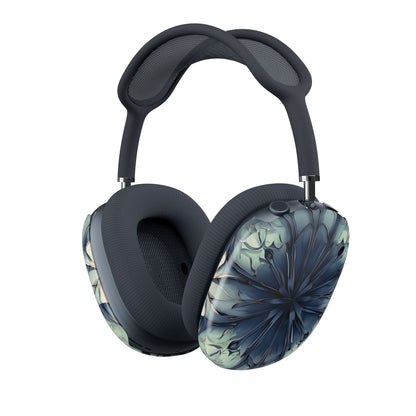 Indigo Mosaic AirPods Max cover with dark blue abstract floral burst on soft pale background, angled view on Apple AirPods Max headphones
