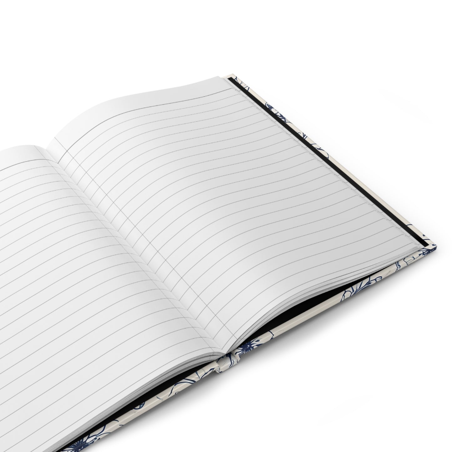 Open hardcover journal showing lined writing pages inside Blossom Sketch notebook