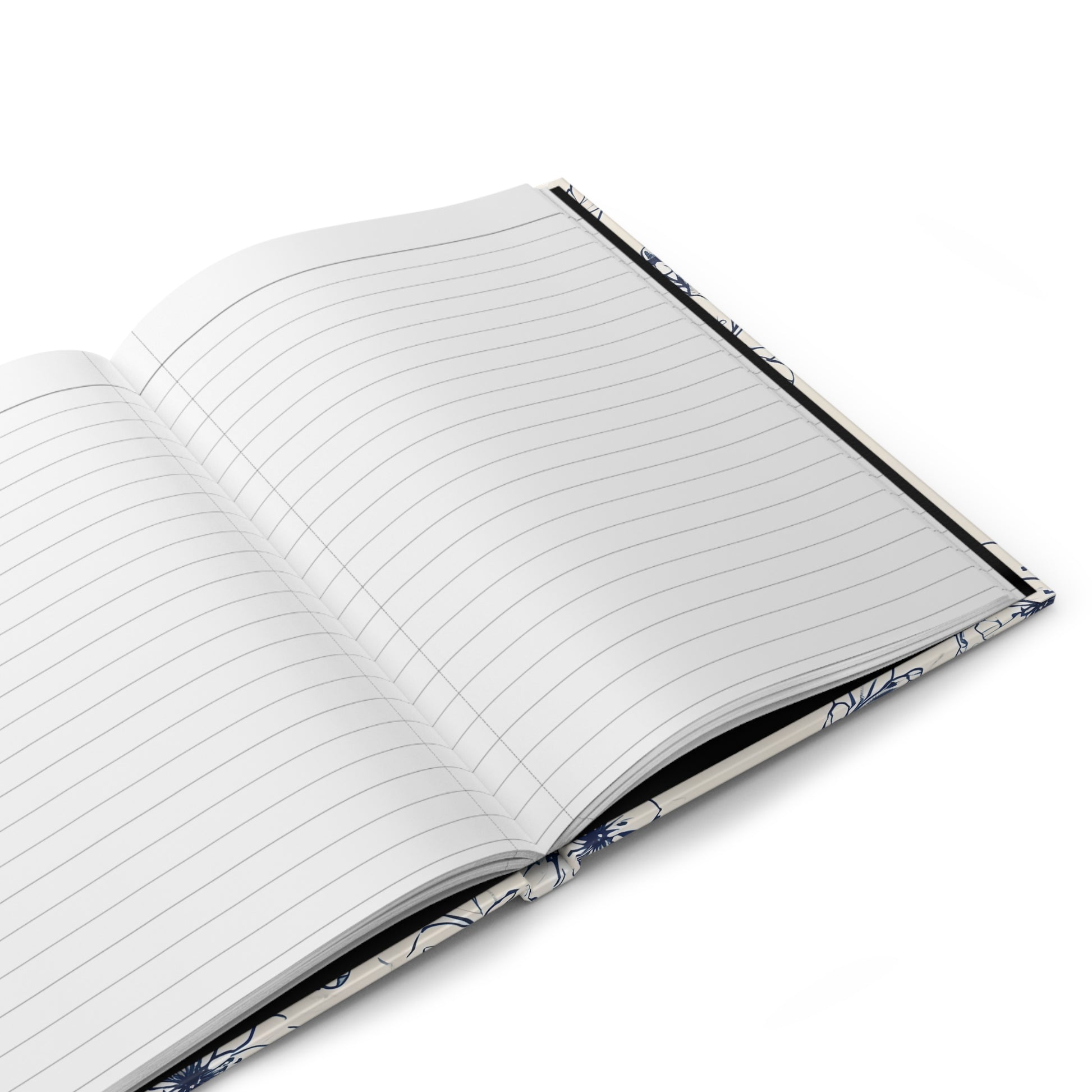 Open hardcover journal showing lined writing pages inside Blossom Sketch notebook