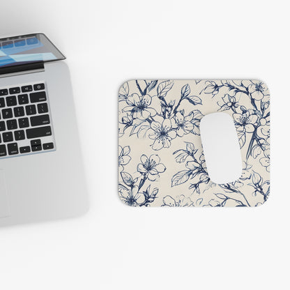 Blossom Sketch mouse pad beside laptop displaying floral sketch artwork