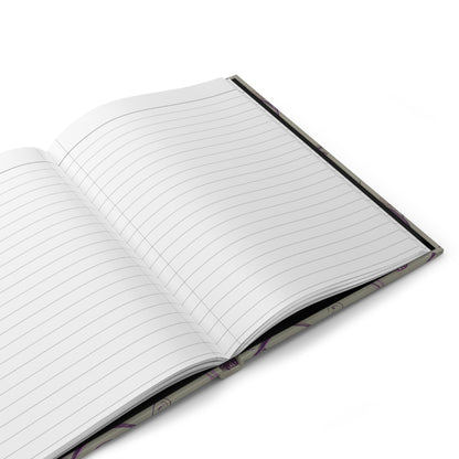 Open hardcover journal showing lined writing pages inside Twilight Thistle Bloom notebook