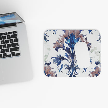 Delft Reverie mouse pad beside laptop displaying Delft-style floral artwork