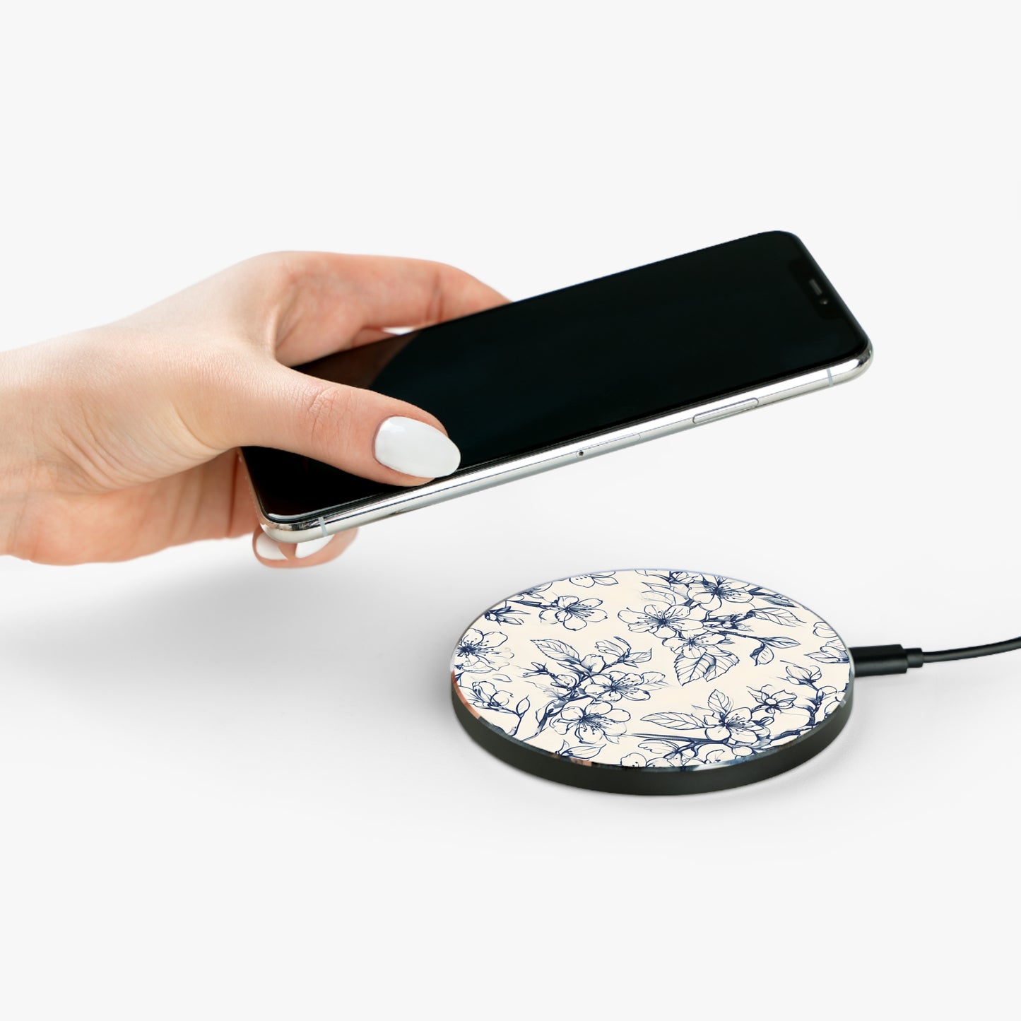 Hand placing smartphone on Blossom Sketch blue floral sketch design Qi wireless charger