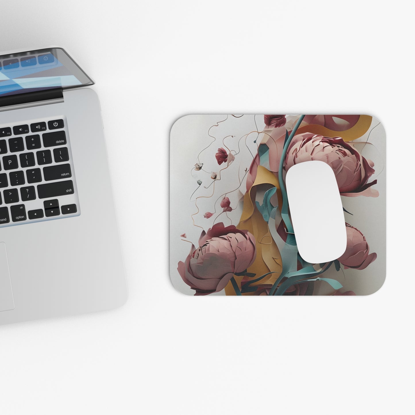 Blushing Peony Veil mouse pad beside laptop displaying pink peony artwork
