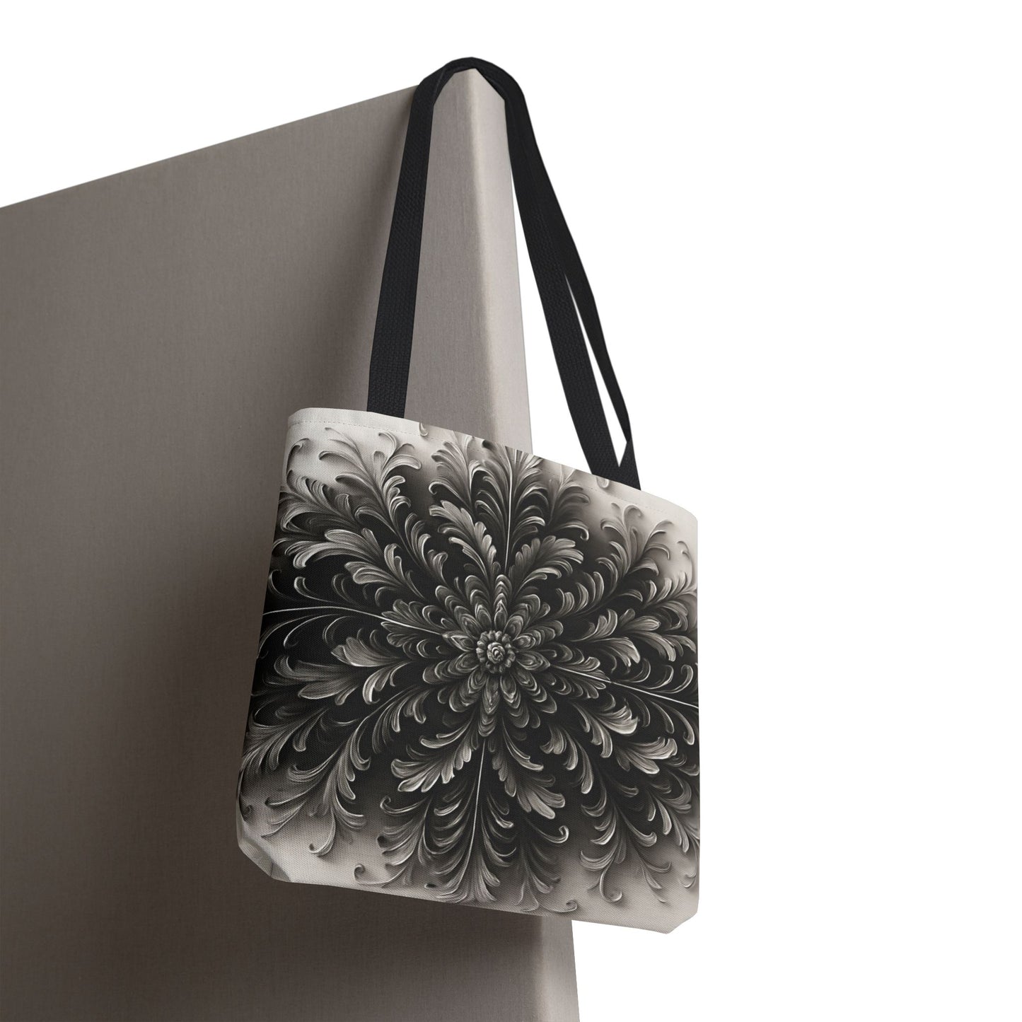 Obsidian Bloom canvas tote bag hanging with striking black bloom floral artwork