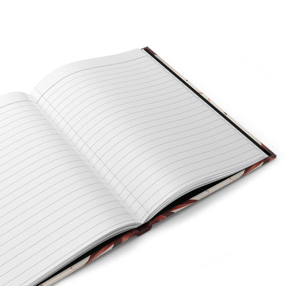 Open hardcover journal showing lined writing pages inside Garnet Starburst notebook