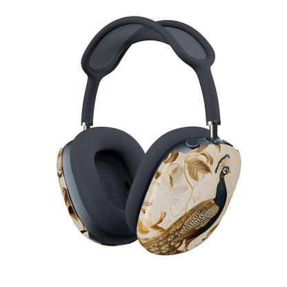 Golden Plumage AirPods Max cover with elegant gold and black peacock on cream background, angled view on Apple AirPods Max headphones