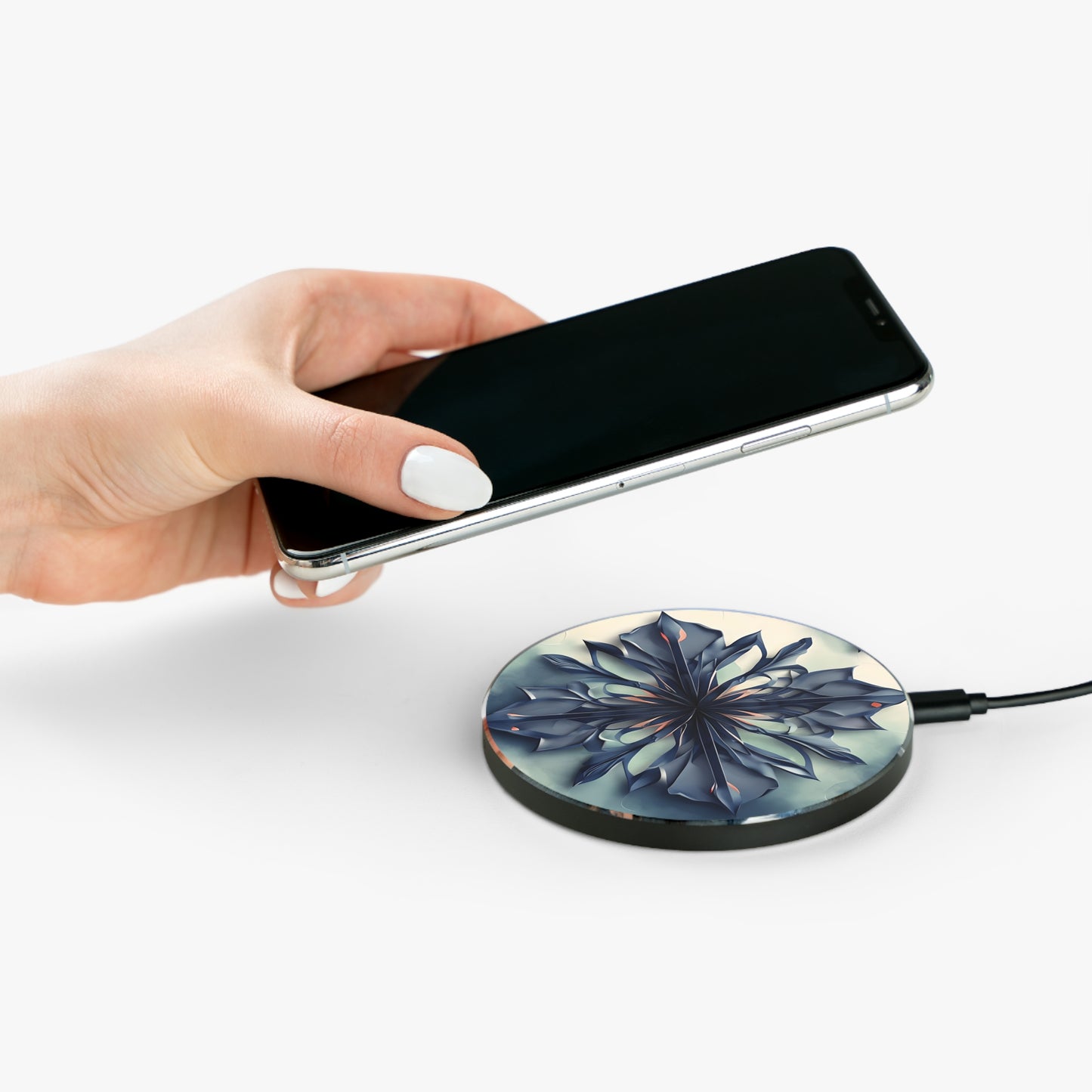 Hand placing smartphone on Frosted Indigo Bloom indigo floral design Qi wireless charger