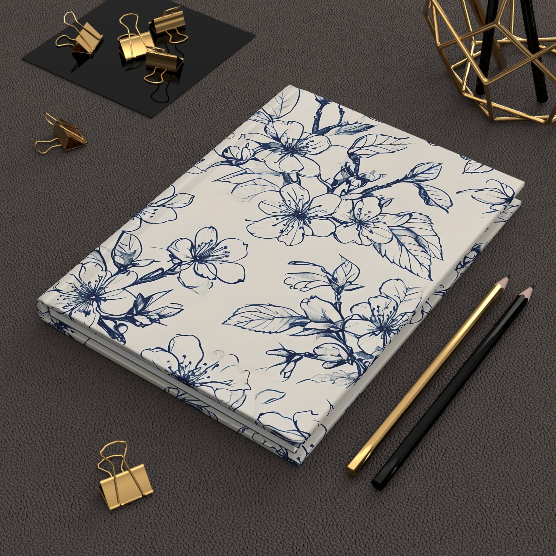 Blossom Sketch hardcover journal on desk with pencils and stationery
