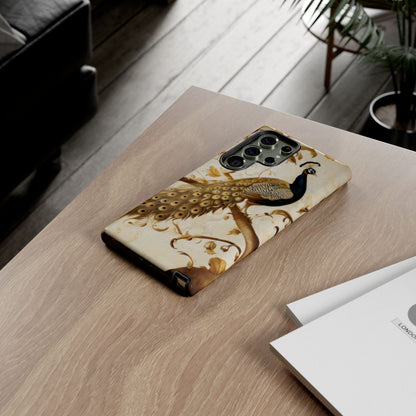 Golden Plumage Samsung Galaxy peacock phone case on wooden desk beside laptop and notebook, elegant lifestyle flat lay