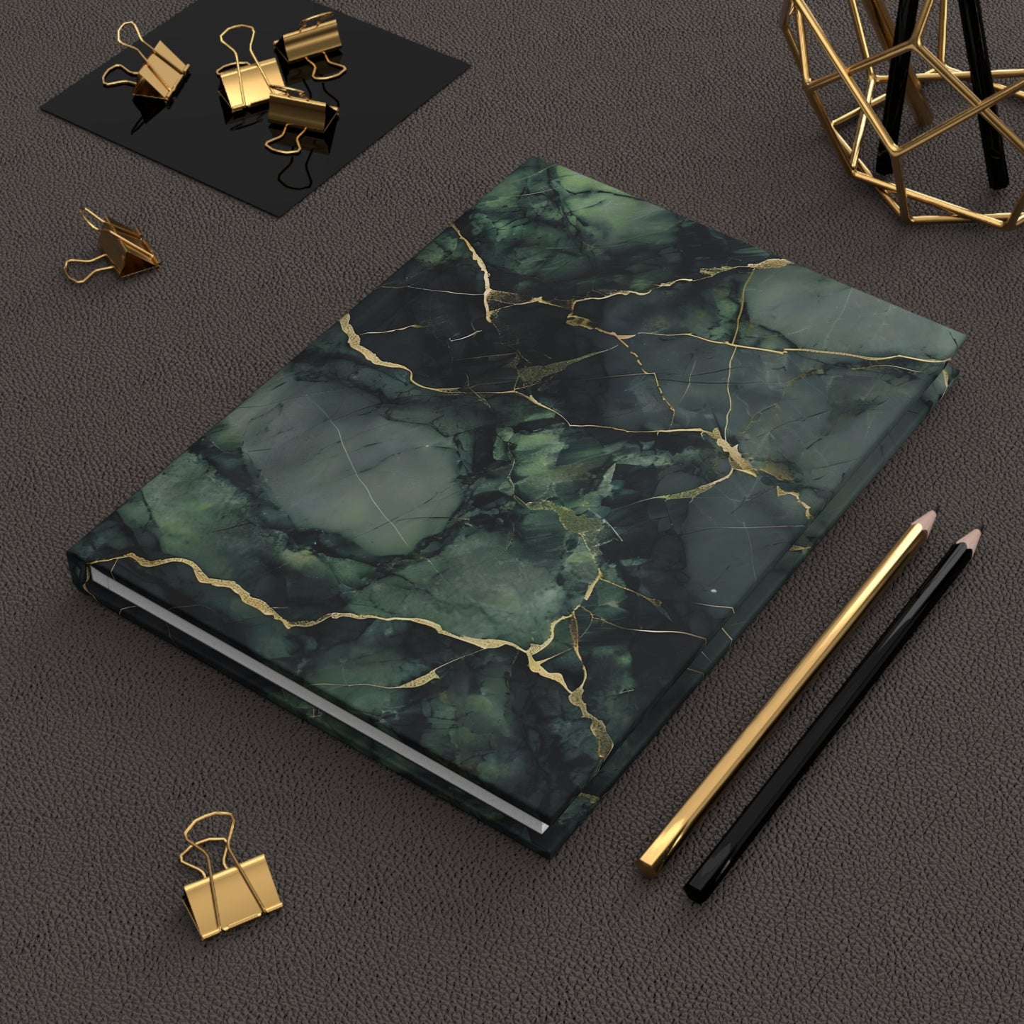 Verdant Vein hardcover journal on desk with pencils and stationery