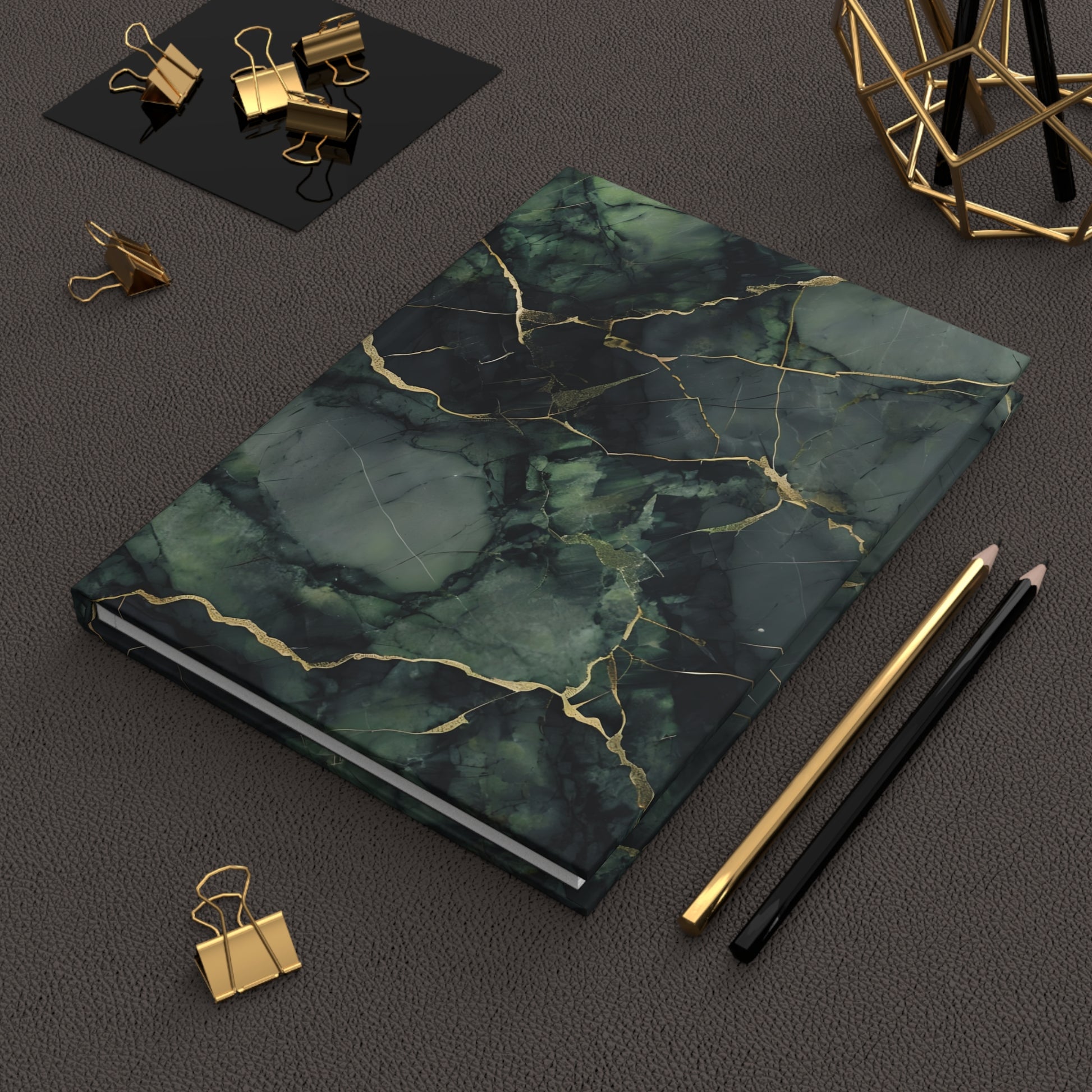 Verdant Vein hardcover journal on desk with pencils and stationery