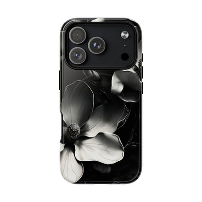 Monochrome Magnolia black and white floral iPhone 17 Pro MagSafe case featuring elegant magnolia blossoms on a dramatic dark background.