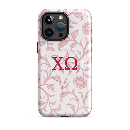 Chi Omega iPhone 15 Pro Max case featuring delicate floral toile pattern in cardinal red with XO Greek letters, MagSafe compatible