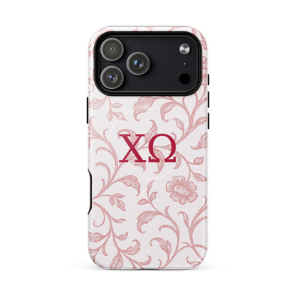 Chi Omega iPhone 17 Pro Max case featuring delicate floral toile pattern in cardinal red with XO Greek letters, MagSafe compatible