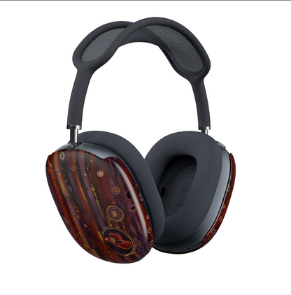 Red Hat Society AirPods Max covers on the headphones with dark blue padded ear cushions and headband, featuring a glossy decorative outer shell with a swirling red, brown, and gold abstract pattern, shown on a plain white background.