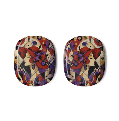 A pair of oval-shaped AirPods Max Covers for Red Hat Society members featuring a colorful Art Deco style design with stylized faces, red hats, and geometric shapes on a cream background.