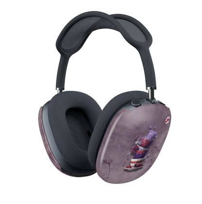A pair of over-ear headphones with dark blue mesh and padding, featuring decorative purple marbled covers on the outer earcups with a whimsical stack of teacups in red and purple alongside the Red Hat Society logo.