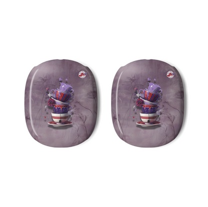 Two matching AirPods Max Covers with rounded corners, featuring a whimsical illustration of stacked teacups in red, white, and purple on a dusty purple background with faint tree branches alongside the Red Hat Society logo.