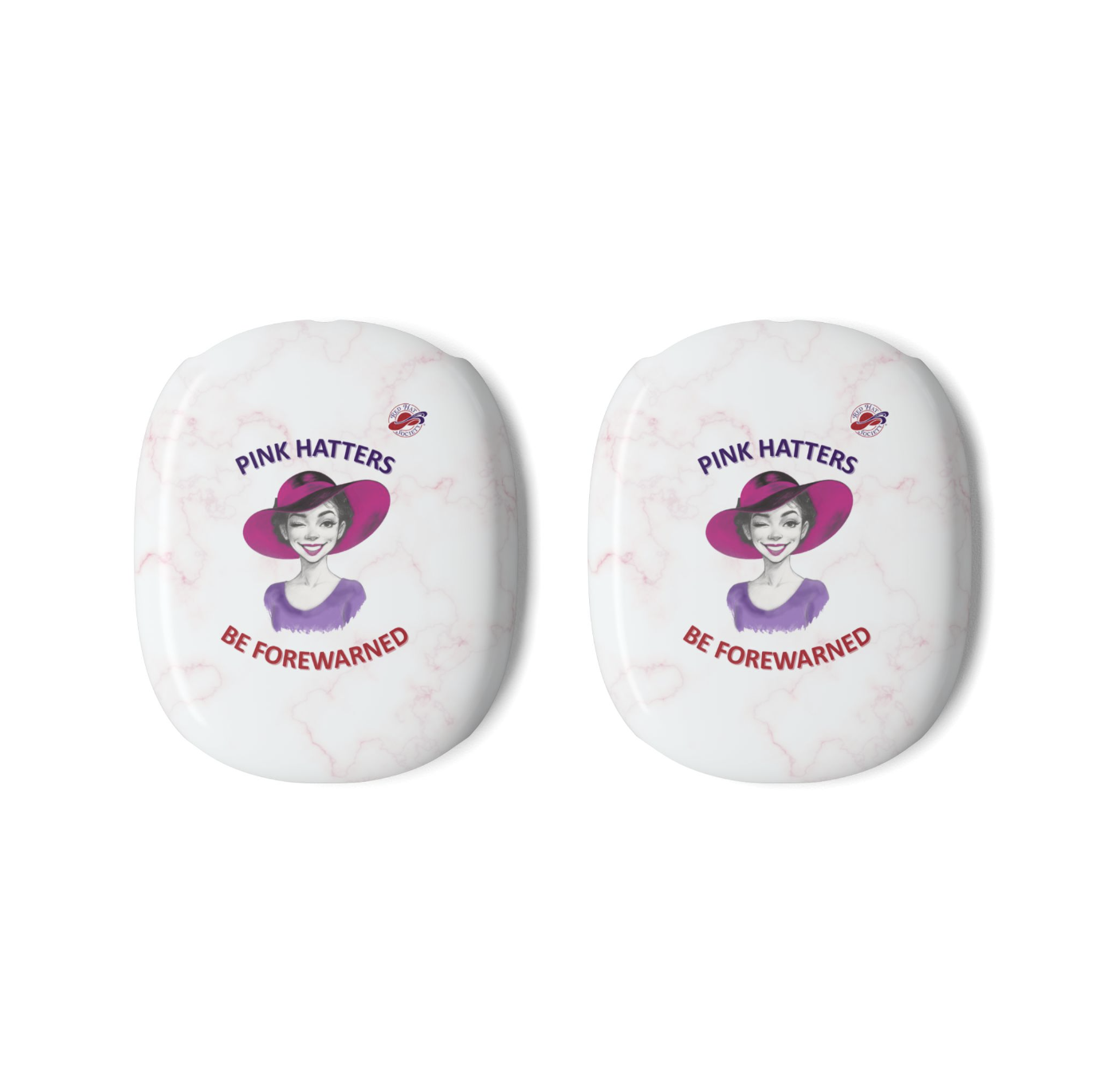 Two white marble-patterned AirPods Max Covers, each printed with an illustration of a woman winking in a pink hat, the text 'PINK HATTERS' above, and 'BE FOREWARNED' below alongside the Red Hat Society logo.