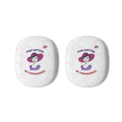 Two white marble-patterned AirPods Max Covers, each printed with an illustration of a woman winking in a pink hat, the text 'PINK HATTERS' above, and 'BE FOREWARNED' below alongside the Red Hat Society logo.