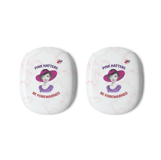 Two white marble-patterned AirPods Max Covers, each printed with an illustration of a woman winking in a pink hat, the text 'PINK HATTERS' above, and 'BE FOREWARNED' below alongside the Red Hat Society logo.