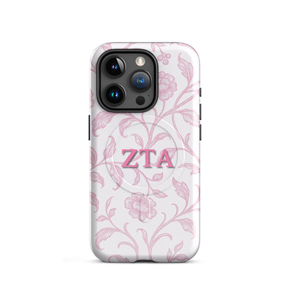 Zeta Tau Alpha floral toile iPhone 15 Pro case with pink vine pattern and ZTA Greek letters MagSafe compatible on white background