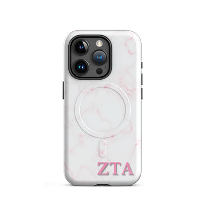 Zeta Tau Alpha marble iPhone 15 Pro case with soft pink veining and pink ZTA Greek letters MagSafe compatible on white background
