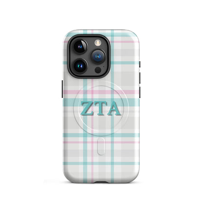 Zeta Tau Alpha plaid iPhone 15 Pro case with pastel teal and pink tartan pattern and ZTA Greek letters MagSafe compatible on white background