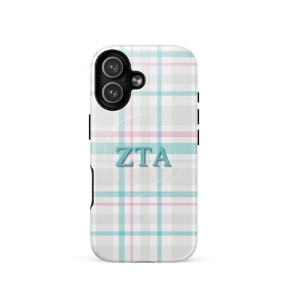 Zeta Tau Alpha plaid iPhone 17 case with pastel teal and pink tartan pattern and ZTA Greek letters MagSafe compatible on white background