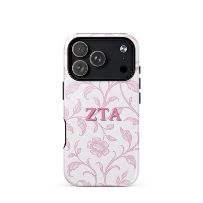 Zeta Tau Alpha iPhone 17 Pro case with blush floral pattern pink ZTA letters MagSafe compatible slim case on white background
